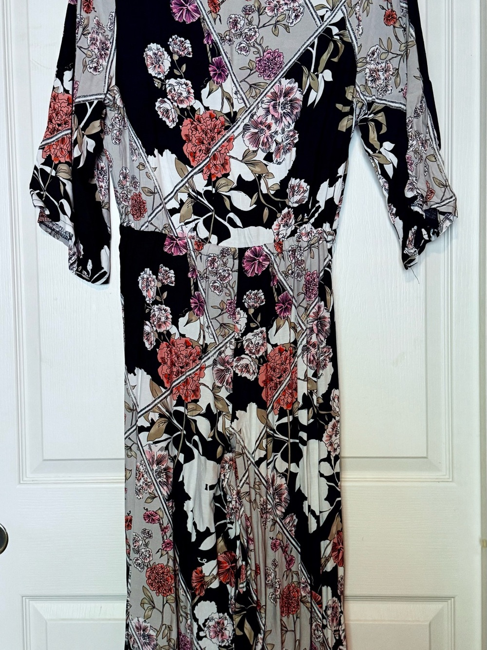 Wrap Top Flowy Leg Jumpsuit in Lightweight Black Floral Fabric